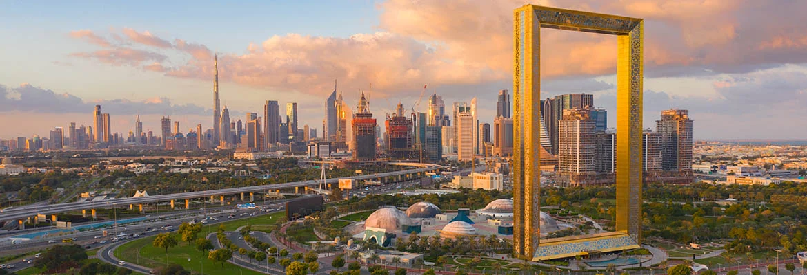 Aerial view of Dubai Frame, Downtown skyline, United Arab Emirates or UAE. Financial district and business area in smart urban city. Skyscraper and high-rise buildings at sunset.
