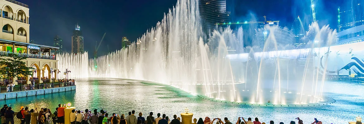 DUBAI - OCT 15: The Dubai Fountain on October 15, 2014 in Dubai, UAE. The Dubai Fountain is the world's largest choreographed fountain system set on the 30-acre manmade Burj Khalifa Lake